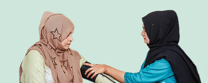 Nurse assisting the patient